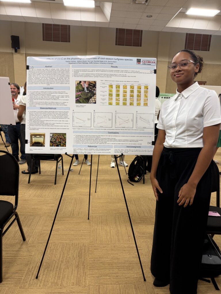 Kayden Holmes presenting her poster